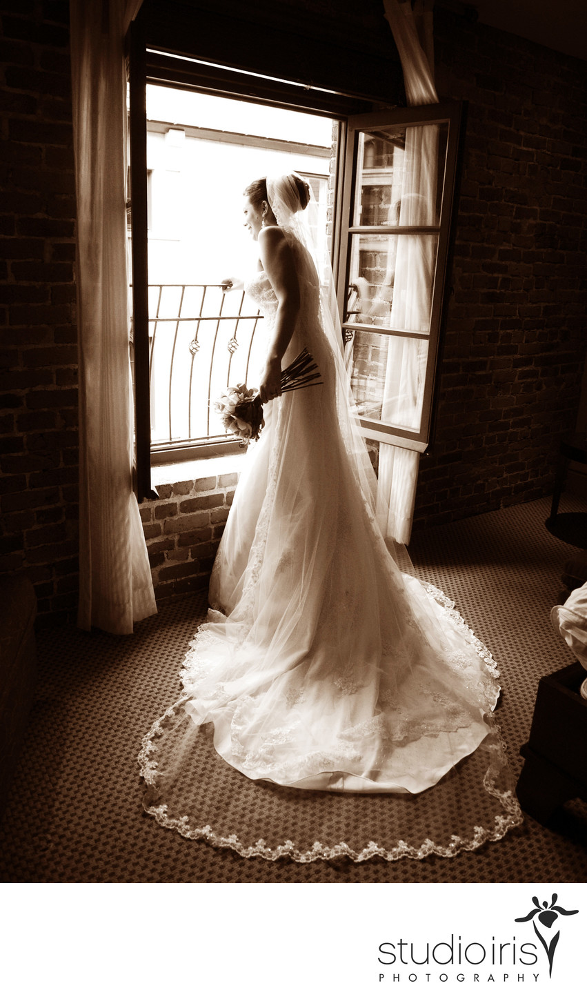 Bride framed by window at Hotel Nelligan in Montreal