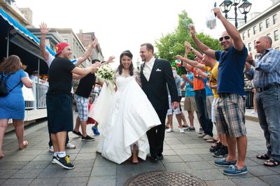 Newlyweds walk through impromptu congratulations from crowd in Old Montreal