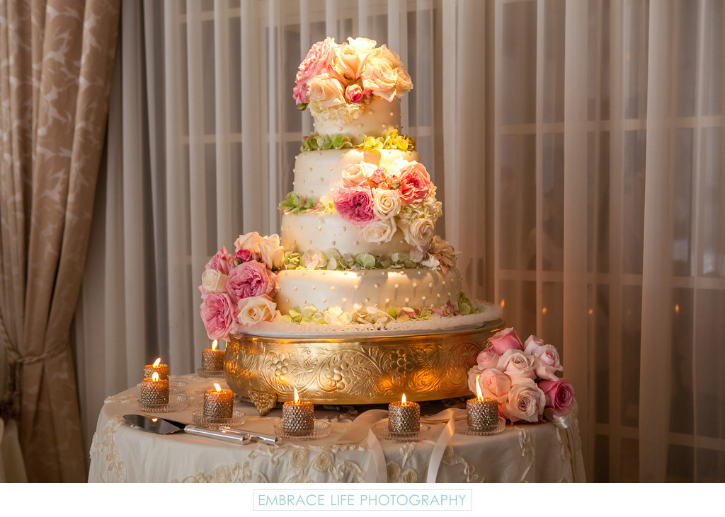 Flower Covered Four-Tier Wedding Cake