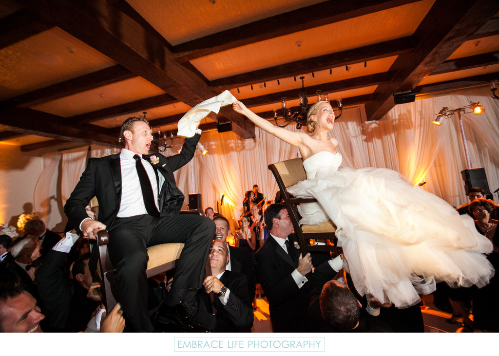 Couple Lifted High During The Hora