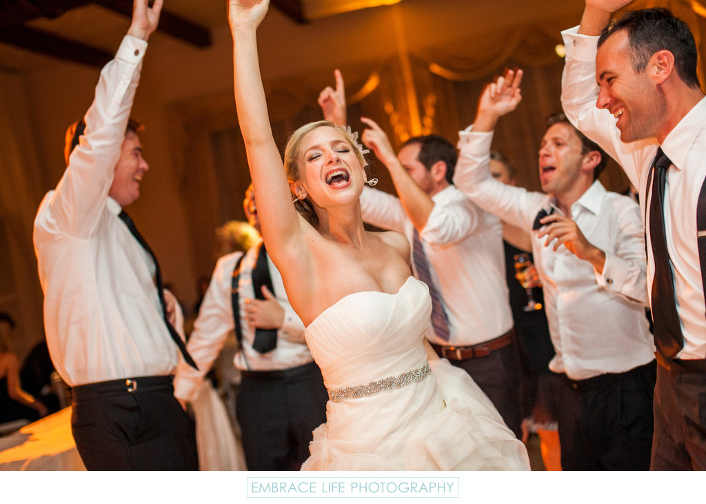 Laughing Bride Dances With Men