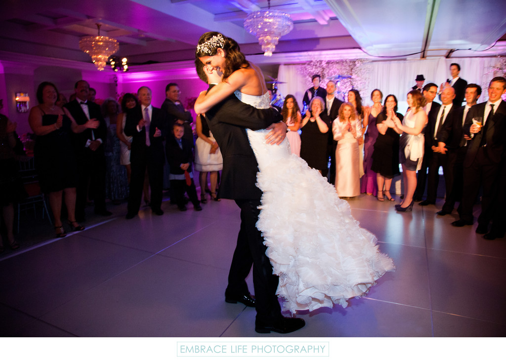Groom Lifts Bride During First Dance as Husband & Wife