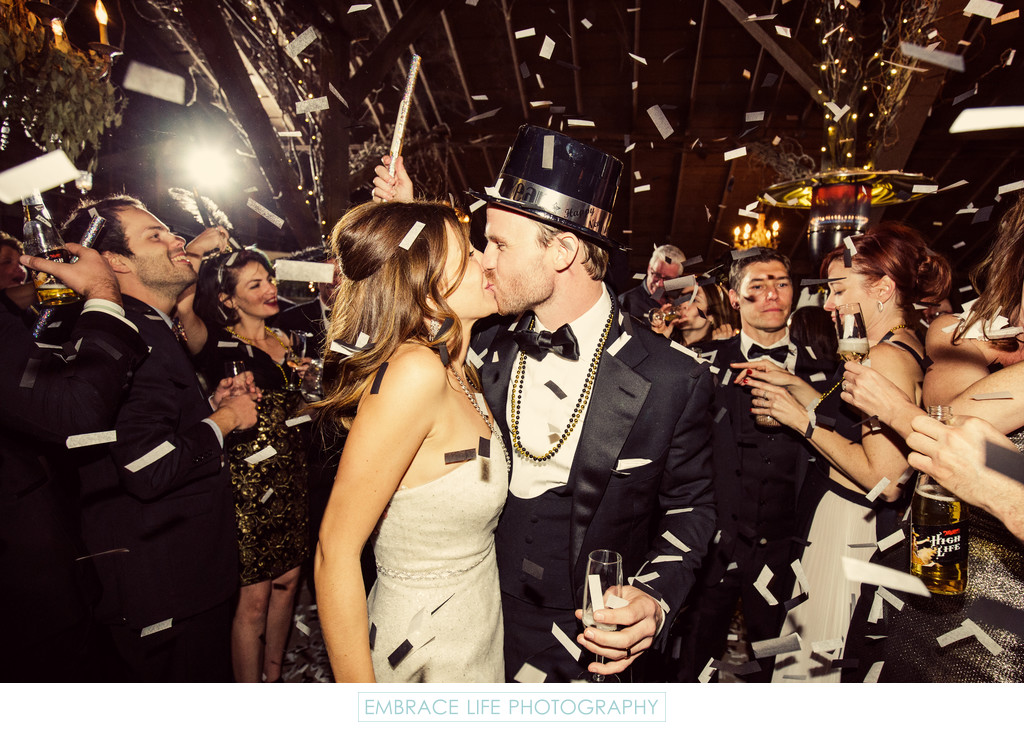 New Years Eve Wedding Couple Kissing Among Confetti