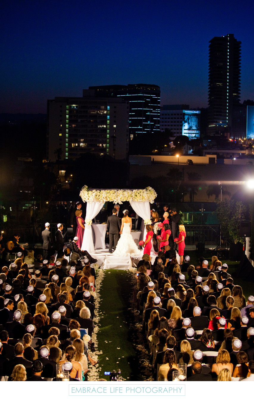Night Time Wedding Ceremony with City Skyline View