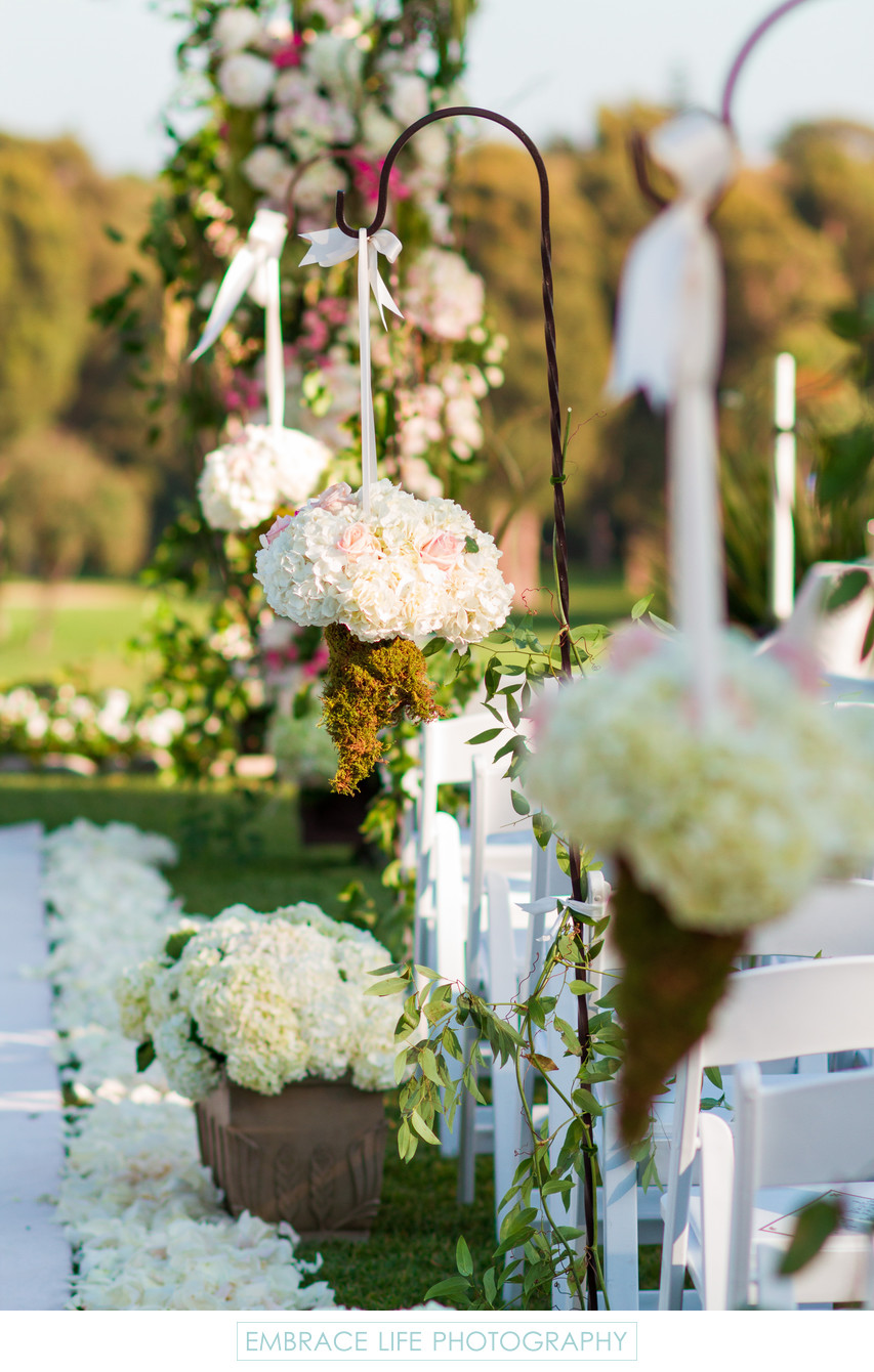 Hanging Floral Bouquets Lining Wedding Aisle
