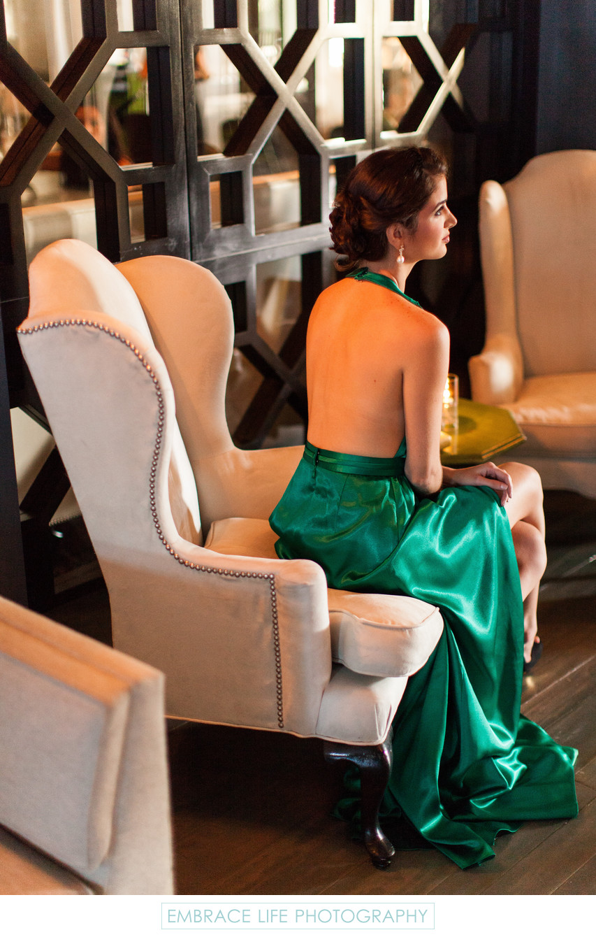Fashionable Wedding Guest in Emerald Satin Gown