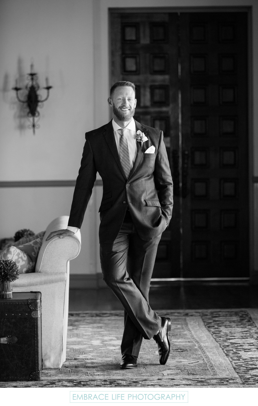 Black and White Wedding Portrait of Smiling Groom