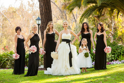 Bride Posing With Bridesmaids and Flower girl