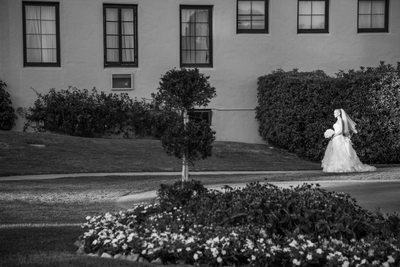 Bride Walking Along Garden Path