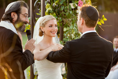 Rabbi and Wedding Couple at Ceremony