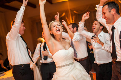 Laughing Bride Dances With Men