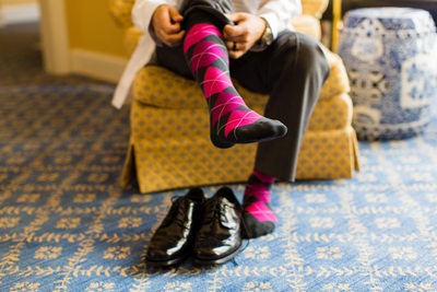 Groom Putting on Pink Argyle Socks
