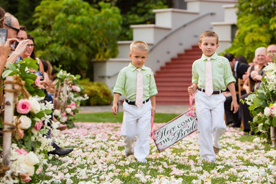 Ring Bearers Holding Rustic Here Comes the Bride Sign
