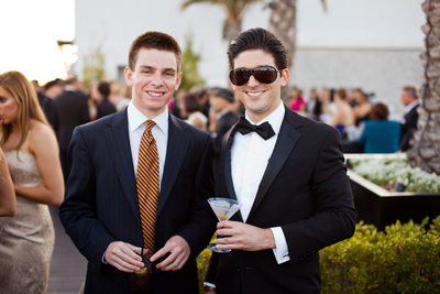 Sharply Dressed Wedding Guests Enjoying Cocktails