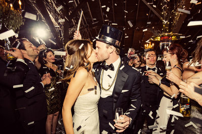 New Years Eve Wedding Couple Kissing Among Confetti