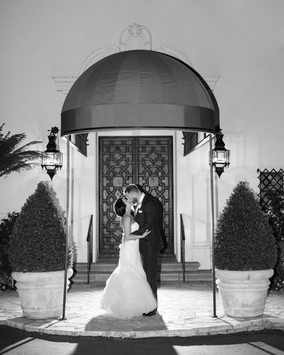 Couple Kissing Outside of Grand Entry Doors