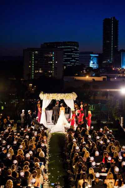 Night Time Wedding Ceremony with City Skyline View