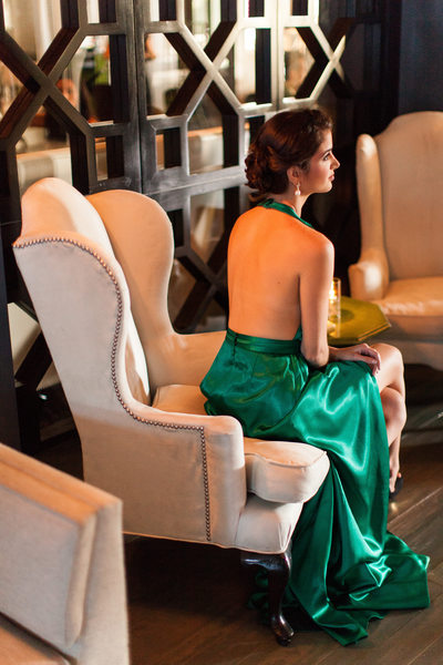 Fashionable Wedding Guest in Emerald Satin Gown