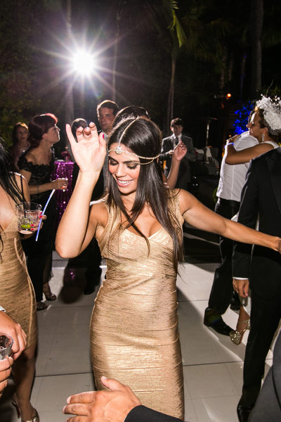 Bridesmaid in Gold Bandage Dress Dancing at Reception