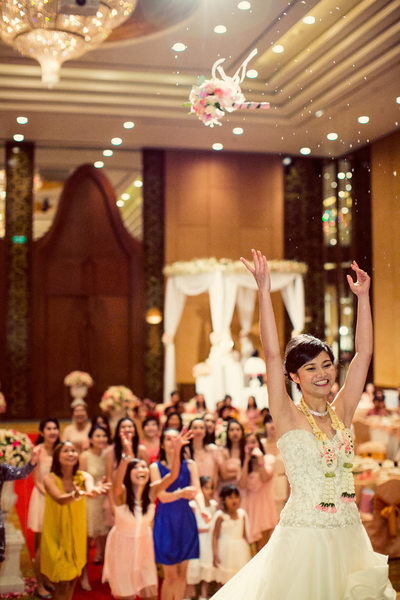 Bouquet Toss During Ballroom Wedding Reception