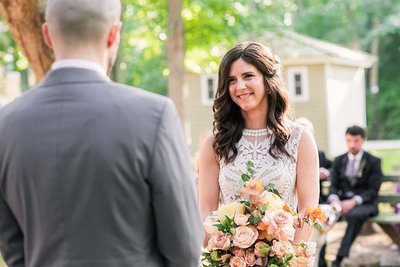Candid Wedding Photography bride smiles at wedding ceremony