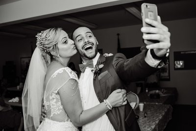 Bride and Brother Take Post Wedding Selfie 