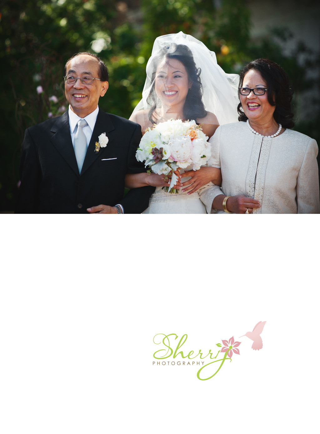 bride walking down the aisle with parents