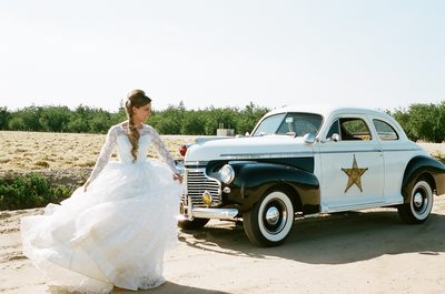 Bride with vintage police car