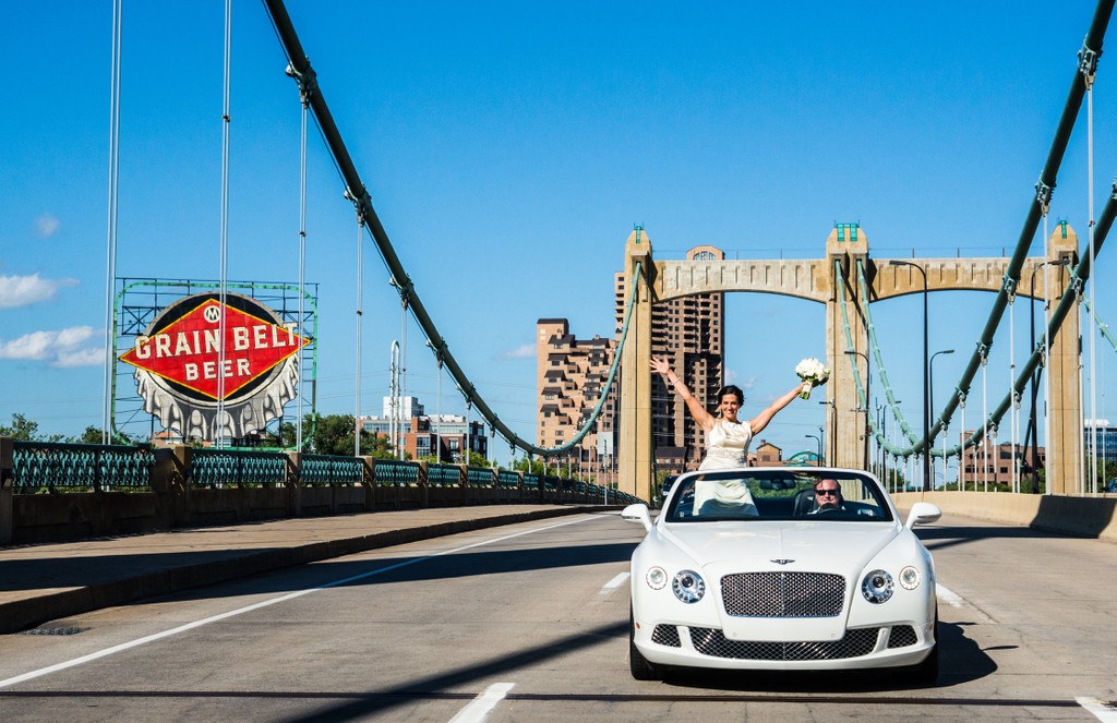 Bride Hanging Out The Convertible on The Hennepin Avenue Bridge