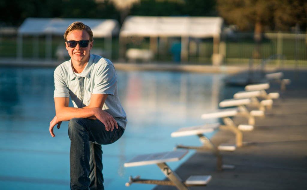 High school swimmer senior portrait at home pool 
