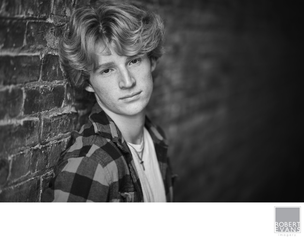 Natural light black and white senior portrait headshot.