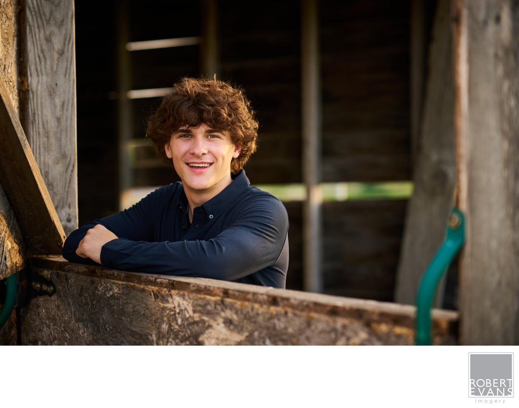 Great smile and headshot in the old barn at sunset