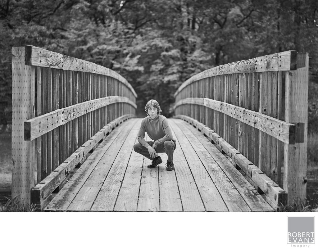  Senior portrait with leading lines on an old wooden bridge