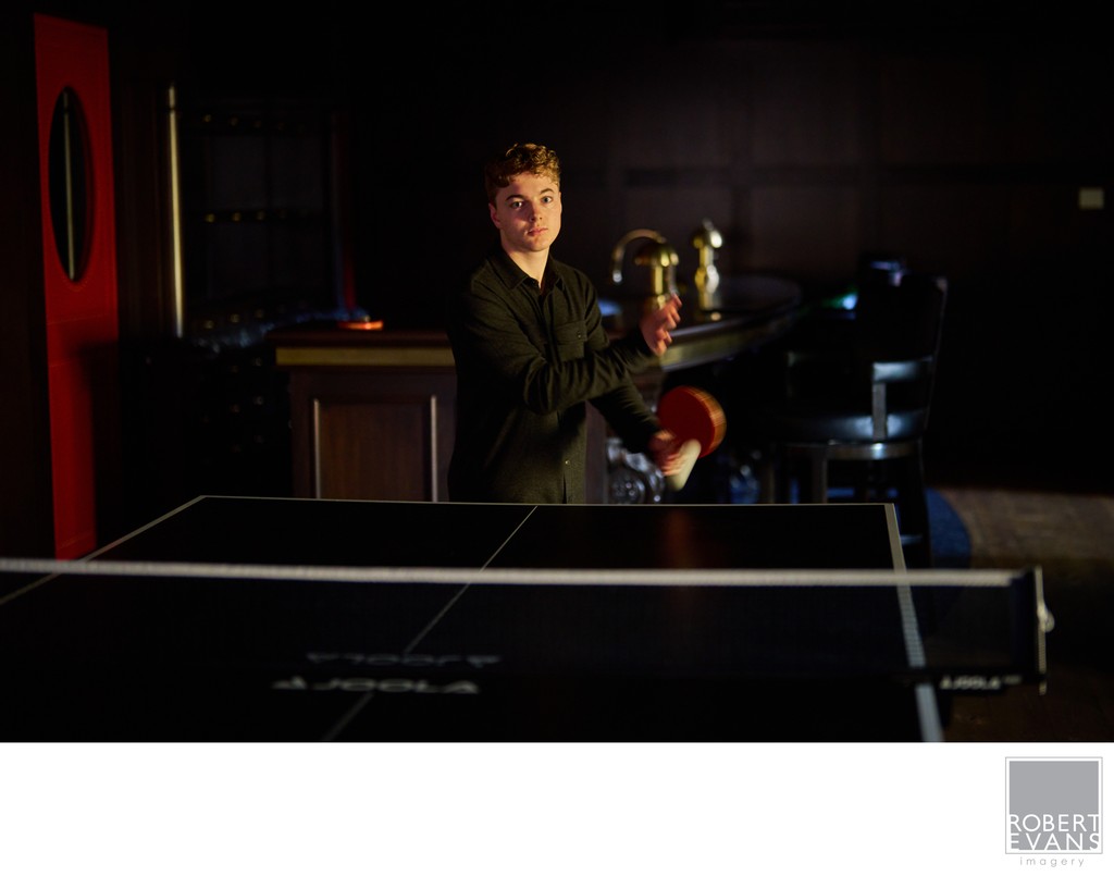 Sports based senior portrait image of a boy playing Ping-Pong