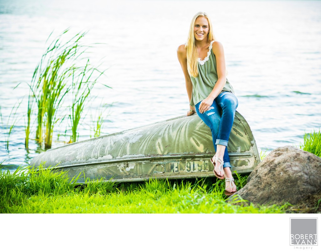 Woman sitting near water/reeds
