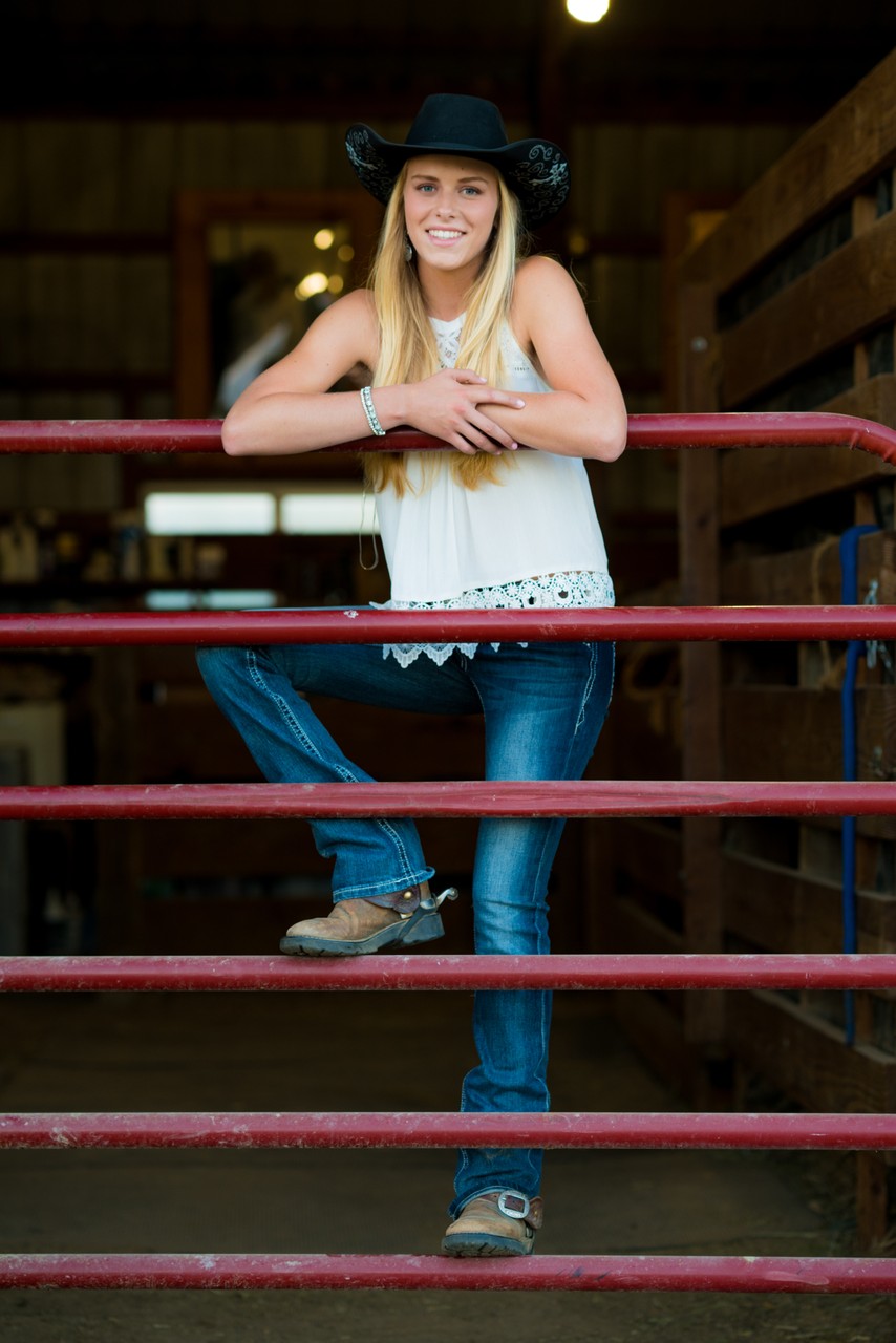 Western Style  Female Senior Portrait At Home On The Farm