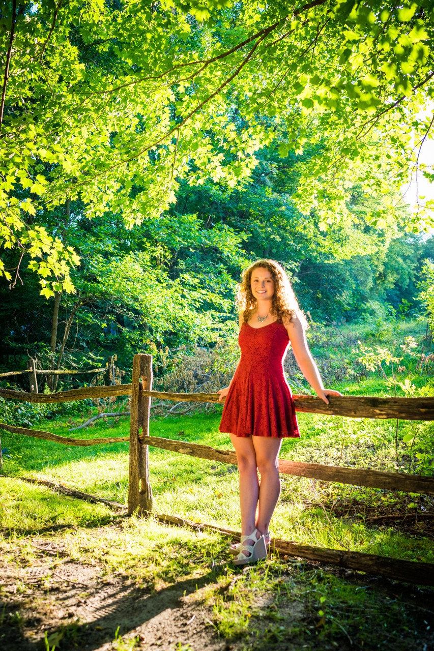 Female Orono High School Senior Portrait backlit by the Sun