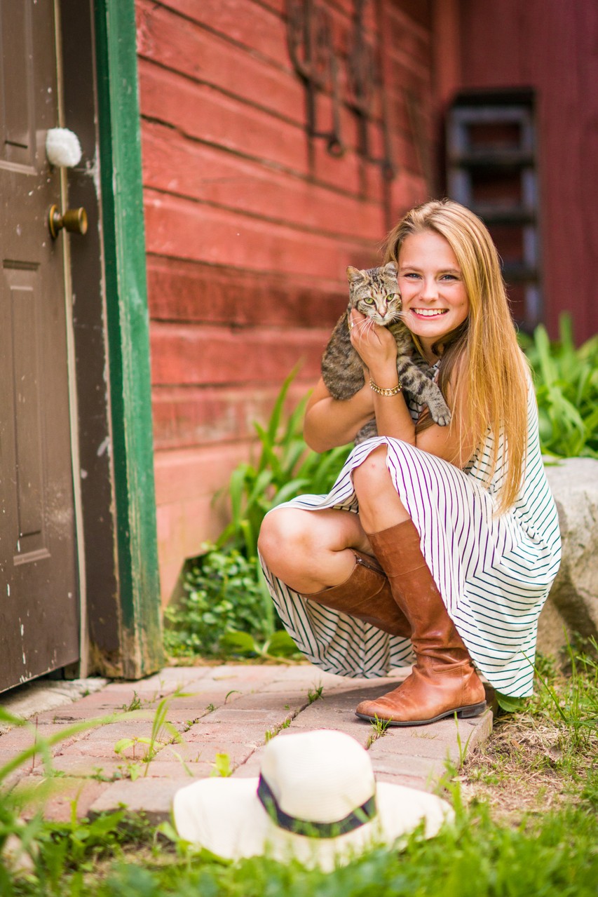 Senior Portrait Of A Female with A cat On t A Farm in Orono Minnesota