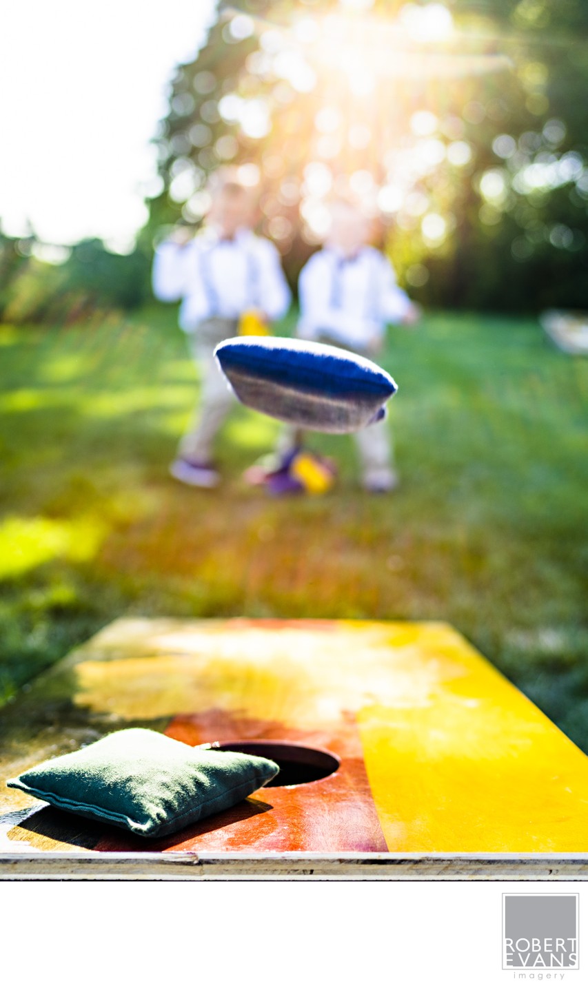 Ring Boys Play Corn Hole At The Wedding