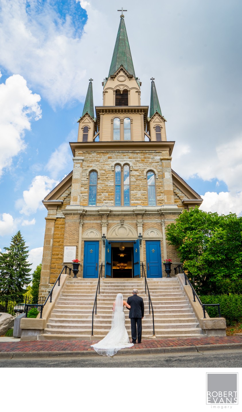 Bride and Dad wait in front of the Our Lady of Lourdes Catholic Church 