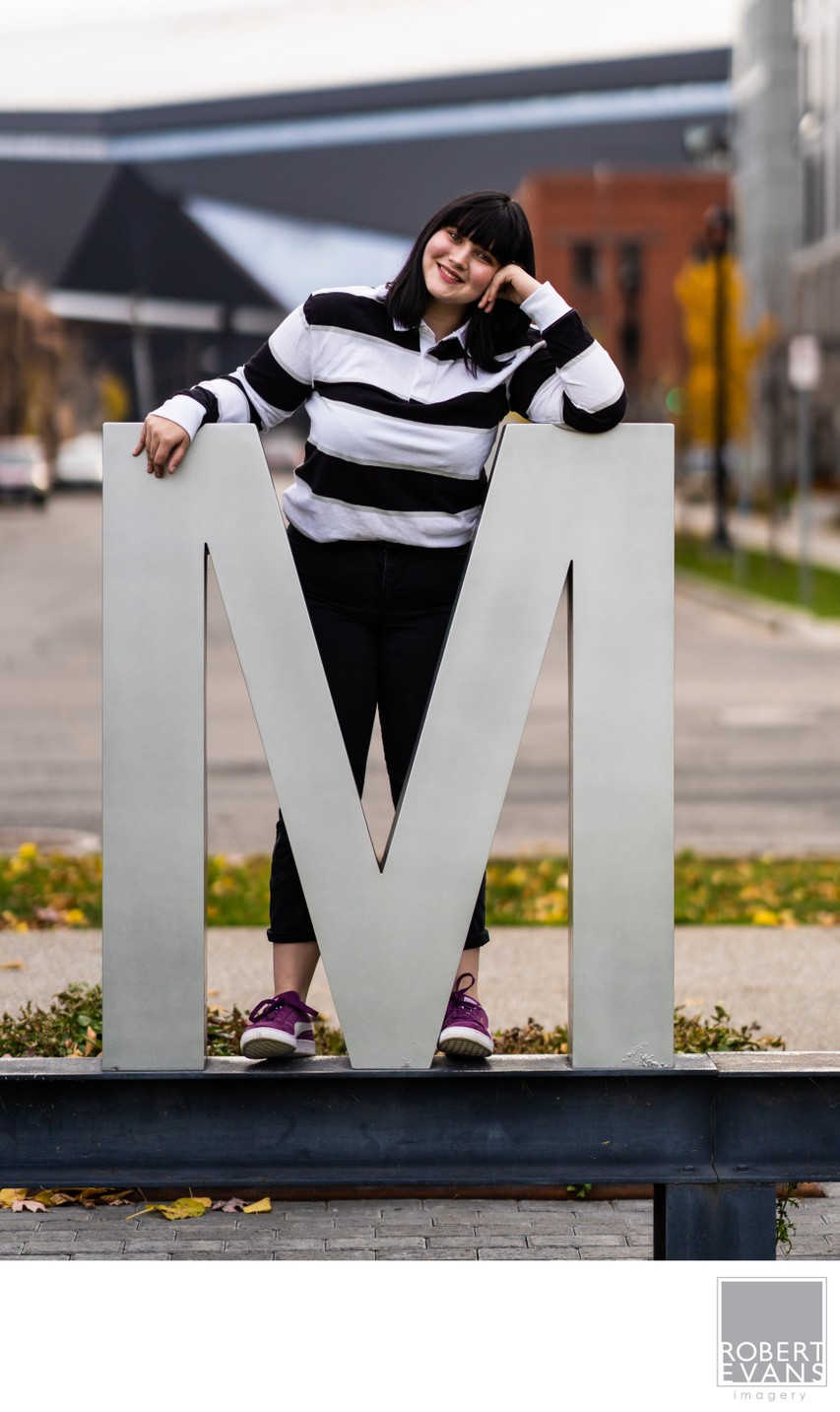 High School Senior Poses Next To A Giant 