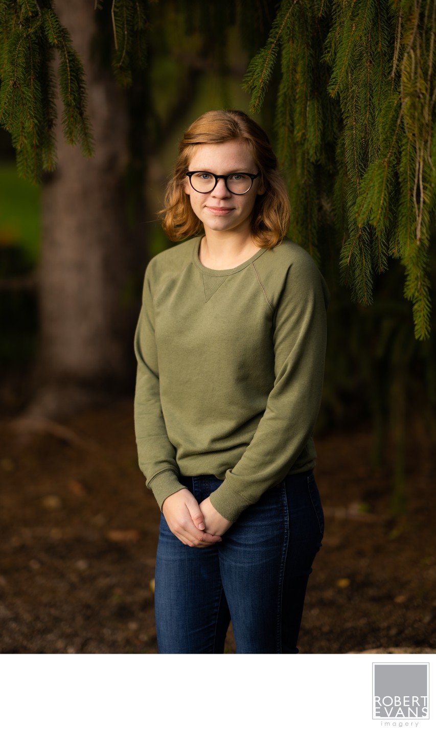 Shooting your subject on a darker background using soft light late in the day. 
