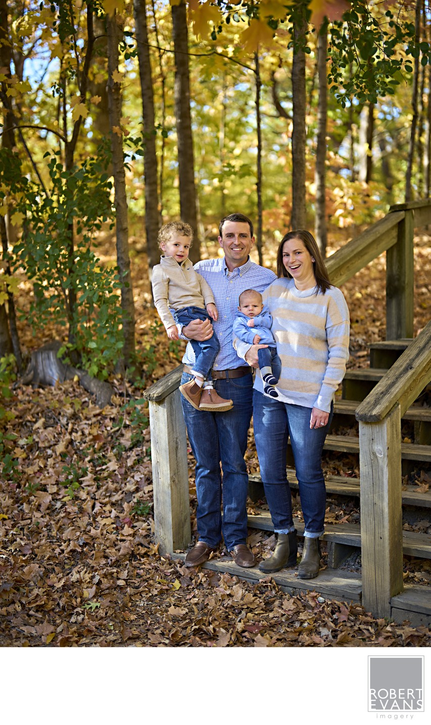 Family of four on wooded steps