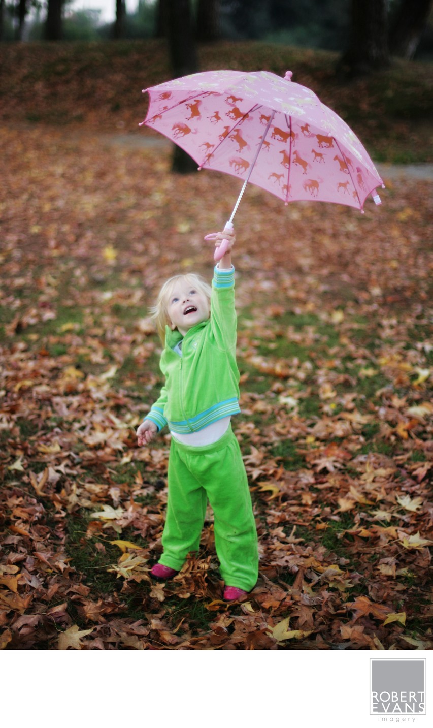 Girl playing with umbrella