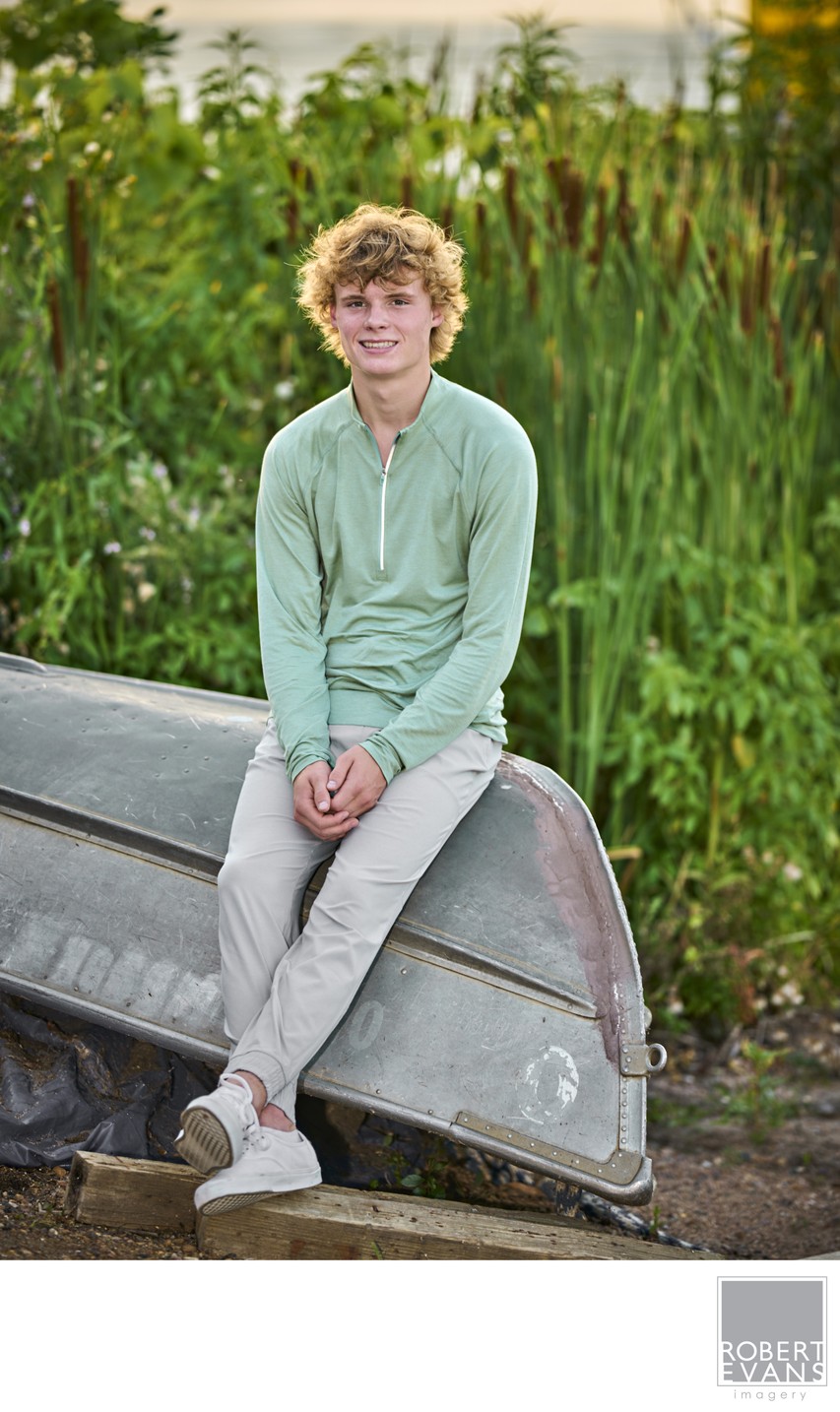 Soft late afternoon light and complimentary colors between outfit and green Cattails