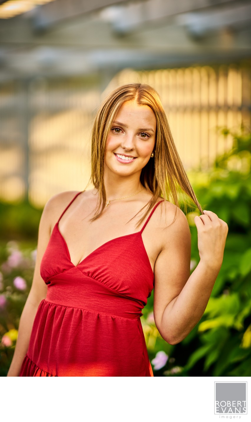 Elegant senior portrait of this Southwest Christian Senior in a Ruby Red dress with beautiful hair light