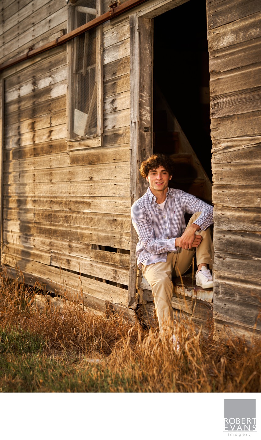 A relaxed late afternoon portrait in the doorway of an old barn