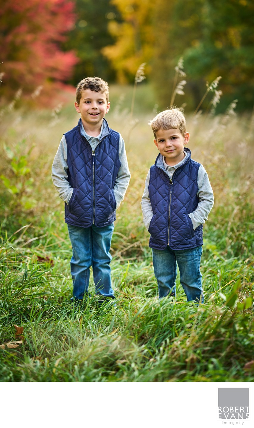 Two brothers in matching vests