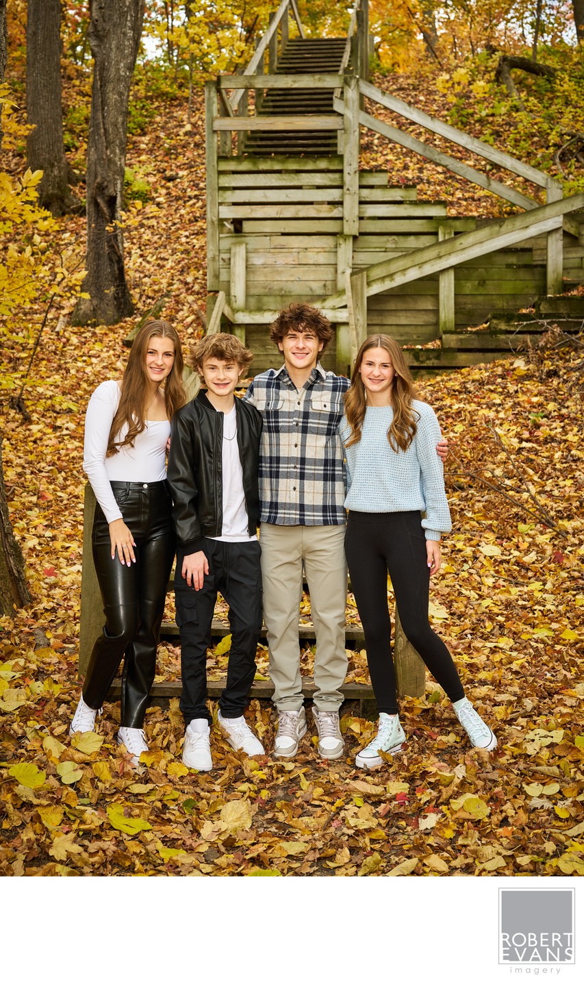Brothers and Sisters Near Wooden Staircase