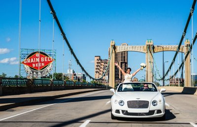 Bride Hanging Out The Convertible on The Hennepin Avenue Bridge